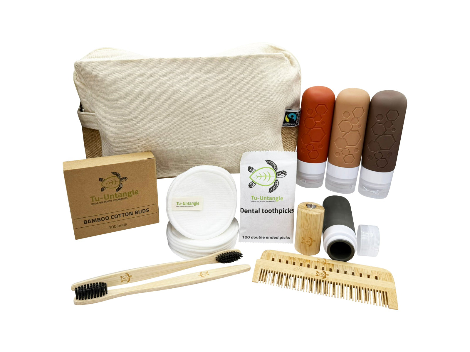 Collection of zero waste travel products including a bag, toothbrush, cotton pads, and a comb on a white background.
